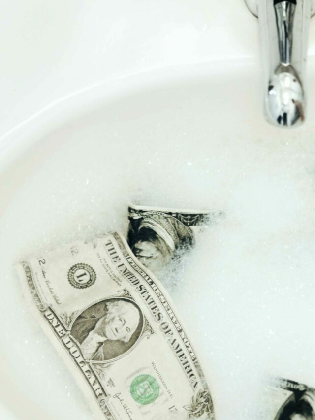 the-art-of-money-laundering-a-sink-with-money-tha-2022-10-05-20-12-05-utc